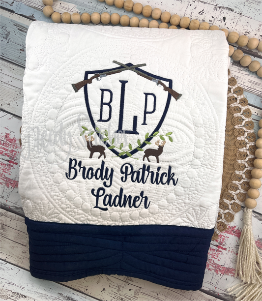 Deer Crest Embroidered Personalized Heirloom Quilt in White with Navy Blue Trim